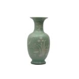 A CHINESE SLIP-DECORATED CELADON VASE.