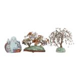 A CHINESE FAMILLE ROSE FIGURE OF BUDAI HESHANG TOGETHER WITH TWO HARDSTONE BOULDERS WITH PLANTS.