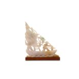 A CHINESE JADEITE ‘RAFT’ CARVING.