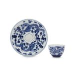 A CHINESE BLUE AND WHITE 'DRAGON' CUP AND SAUCER.