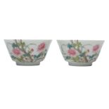 A PAIR OF CHINESE FAMILLE ROSE 'PEONIES' CUPS.