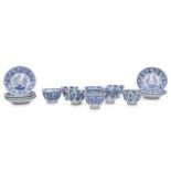 EIGHT CHINESE BLUE AND WHITE 'POMEGRANATE' CUPS AND SEVEN SAUCERS.