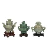 THREE CHINESE GREEN HARDSTONE INCENSE BURNERS AND COVERS.