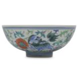 A CHINESE FAMILLE ROSE 'LION DOGS' BOWL.