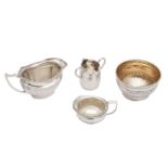 A mixed group of sterling silver milk jugs and a sugar bowl