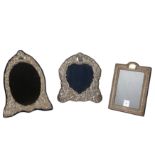 Two silver photograph frames and a mirror,