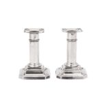 A pair of George V sterling silver dwarf or desk candlesticks, Sheffield 1911 by James Dixon and