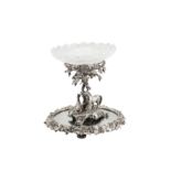 A Victorian silver plated (EPNS) figural centrepiece on a mirror plateau, circa 1860, the