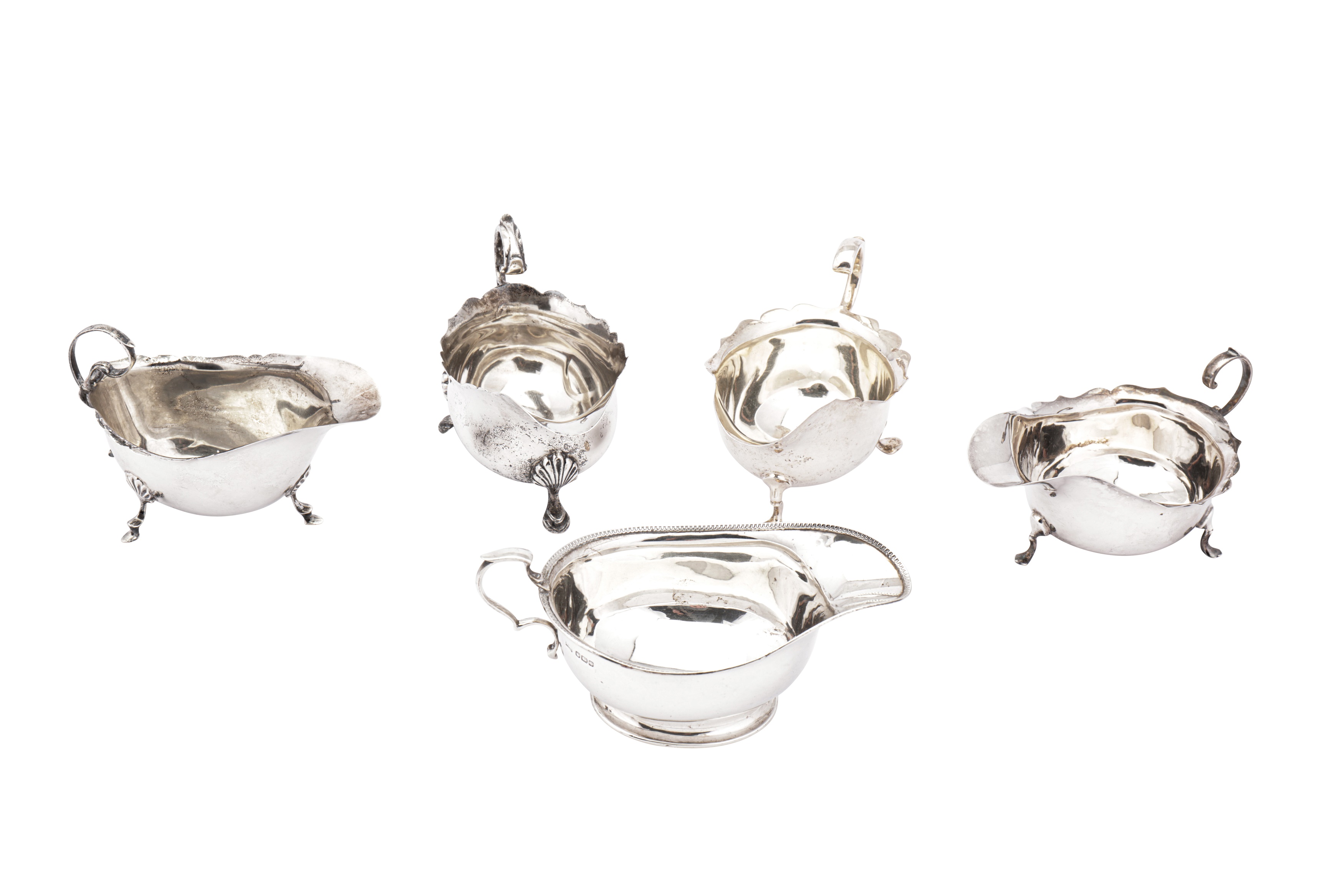 A mixed group of sterling silver sauceboats