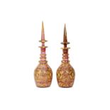 A PAIR OF GILT AND POLYCHROME-PAINTED BOHEMIA PINK CUT-GLASS SPIRIT DECANTERS FOR THE IRANIAN