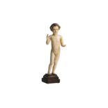 λ A CARVED IVORY FIGURE OF CHRIST AS A BABY BOY