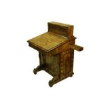 A CARVED CLEAR OLIVE WOOD DAVENPORT DESK