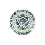 A BLUE AND WHITE IZNIK-STYLE DAMASCUS POTTERY DISH