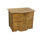 A 19th century Scandinavian pine serpentine commode