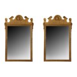 A pair of modern George I style gilt wood mirrors