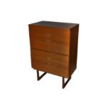 A 1960s teak tallboy or chest of drawers designed by Gunther Hoffstead for Uniflex