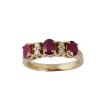 A three stone ruby and diamond ring