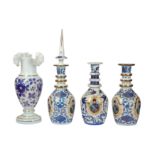 A set of three 20th century glass and enamelled Islamic taste decanters