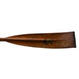 A pine scull oar, dated 1938, painted with a crest and various details