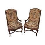A pair of mid 18th Century style carved mahogany open armchairs