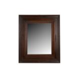 A late 19th Century Jacobean style oak framed mirror of rectangular form