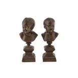 A pair of French 20th century bronze busts of children, after Jean-Antoine Houdon