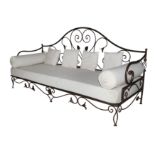 A French wrought iron three seater conservatory sofa, in the manner of Les Lalanne