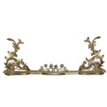 A 19th Century French Baroque style adjustable cast gilt brass fender