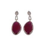 A pair of glass filled ruby and diamond earrings