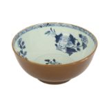 An 18th century Chinese Nanking cargo blue and white and cafe-au-lait porcelain bowl,