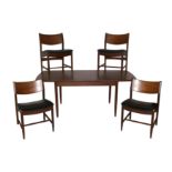 A 1960s teak extending dining table