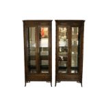 A pair of 20th century Regency style American Chinoiserie display cabinets