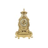 A late 19th century French polished brass mantel clock,