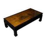 A contemporary Chinese black lacquered coffee table