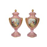 A pair of French late 19th/early 20th century Sevres style porcelain vases and covers
