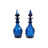 Amended description : A pair of 20th century blue glass decanters with stoppers