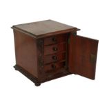 A 19th century mahogany miniature cabinet,