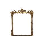 A rococo style carved giltwood and gesso framed overmantel mirror