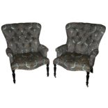 A pair of Victorian style button back armchairs