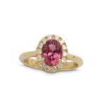 A purple spinel and diamond cluster ring