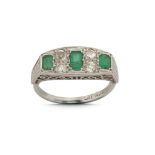 An emerald and diamond ring