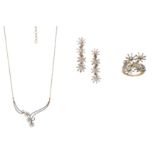 A gold and diamond necklace, ring and earring suite