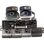 Group of Polaroid Instant print cameras.