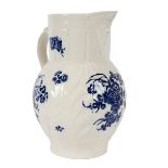 A Caughley cabbage-leaf moulded mask jug, circa 1780, printed in blue with flower sprays,