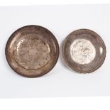 Two French silver saucer dishes, circa 1807, circular, with foliate rims, 14cm and 16cm diameter,