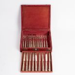 Nine silver dessert knives and twelve forks, Sheffield 1821, with flower decorated,