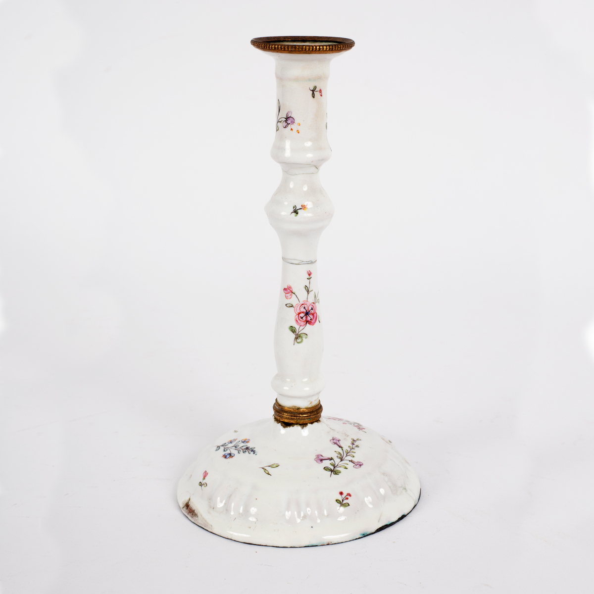 A South Staffordshire white enamel candlestick, circa 1780, painted with simple flower sprays, 14.