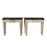 A pair of painted console tables with Portor marble tops, the serpentine tops probably 18th Century,