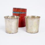 Two Dutch silver beakers, circa 1810 of tapered cylindrical form, nesting in a fitted case,