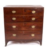 A George IV mahogany chest of two short over three long drawers, on splay feet,